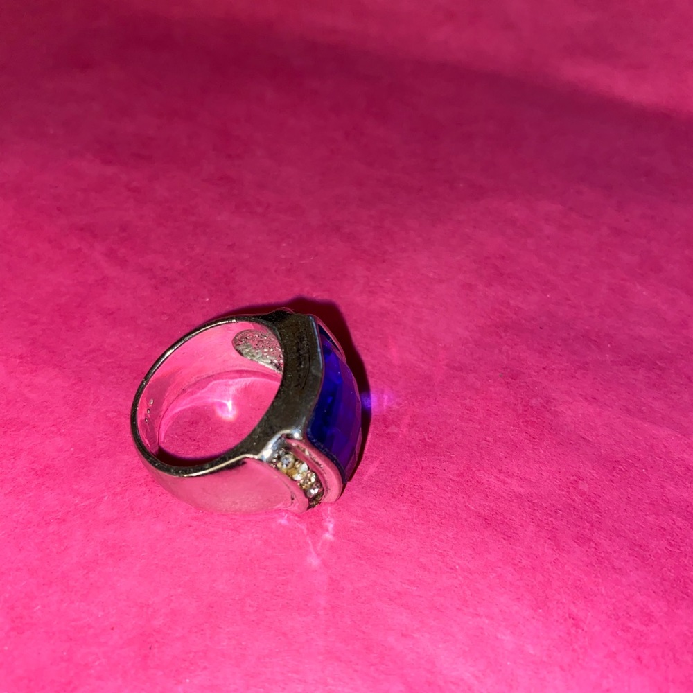 Fashion- chunky blue stone ring. Missing one of the tiny stones